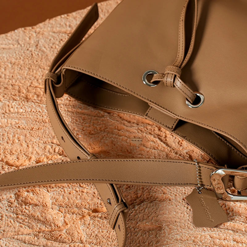 The Cordelia Cow Leather Metal Buckle Solid Long Strap Bucket Bag