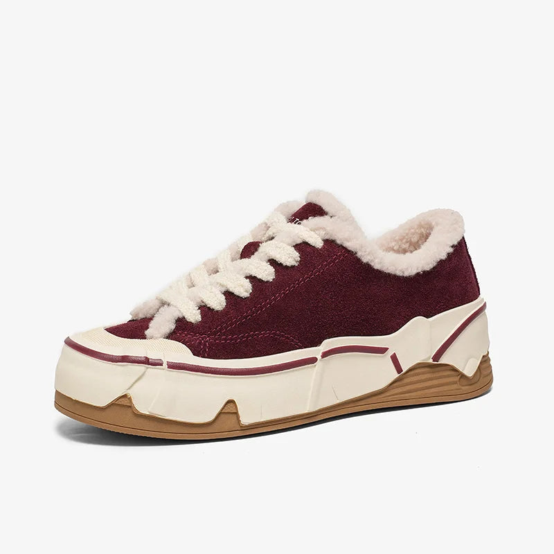 Maroon sneaker with white laces and fur lining on a white background