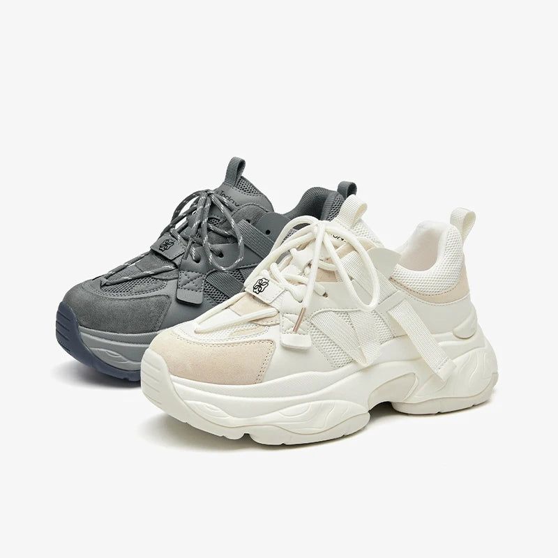 Gray and white sneakers on a white background