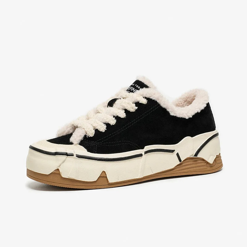 Black sneaker with white fur lining on a white background