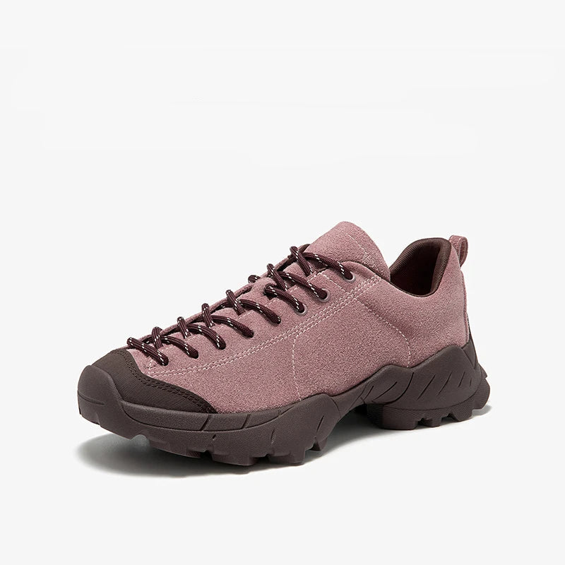 Pink sneaker with brown accents on a white background, accompanied by text and a size guide icon.