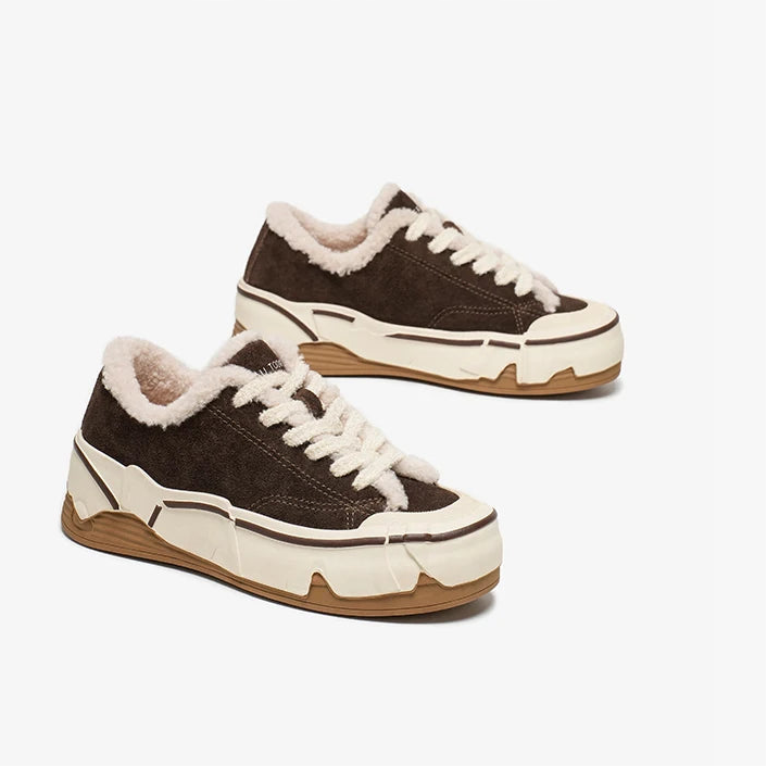 Brown sneakers with white laces and soles on a white background, branded
