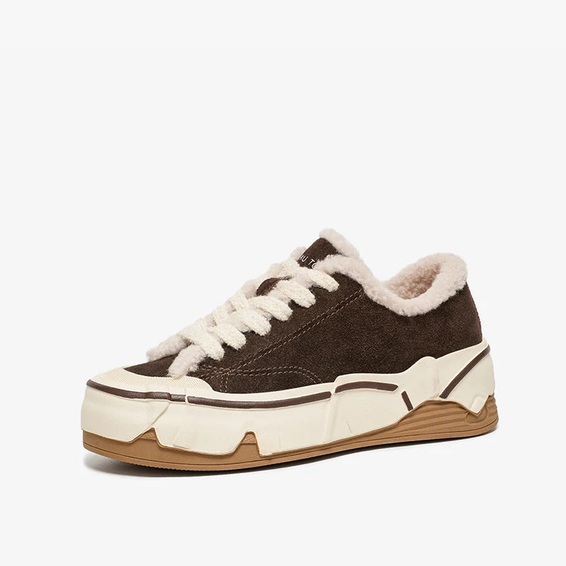Brown sneaker with white laces and sole on a white background