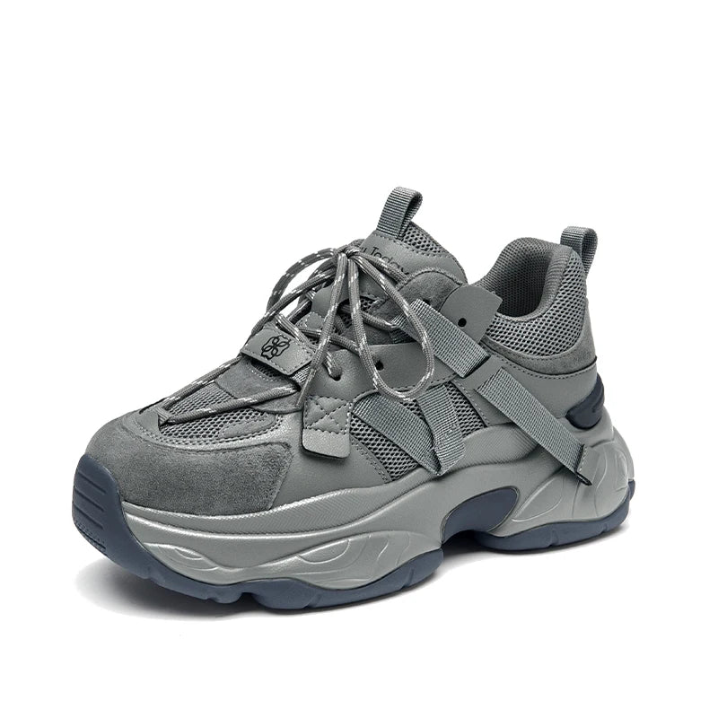 Gray sneaker with thick sole on a white background