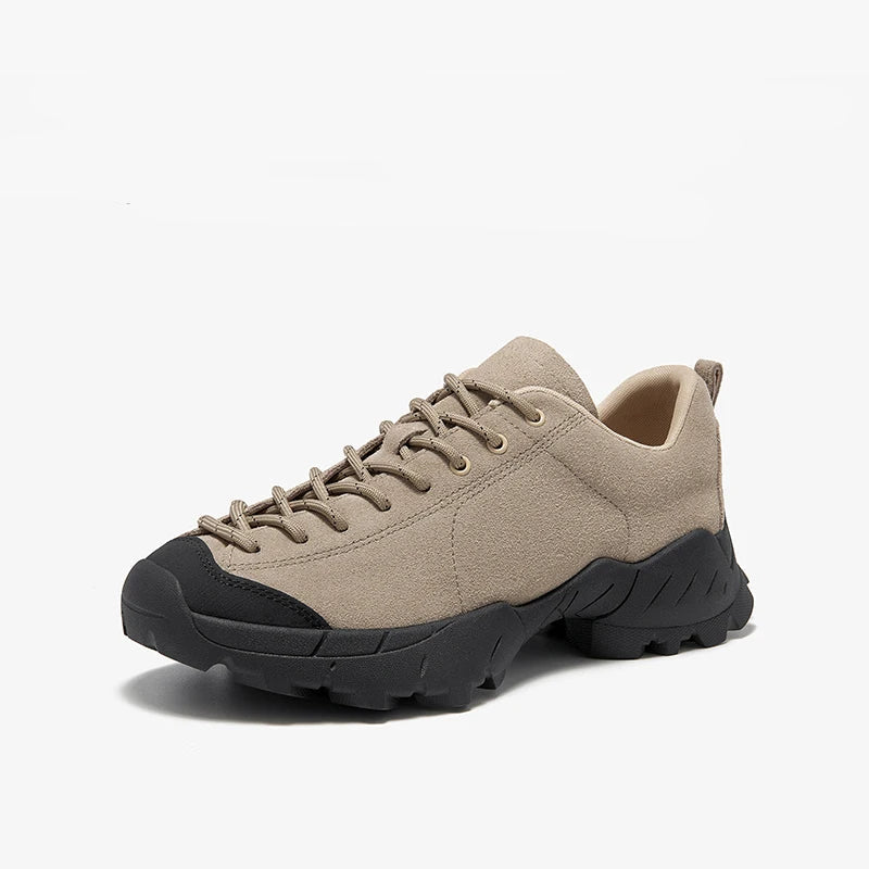 Beige outdoor shoe with black sole on a white background, with text advising to choose a smaller size if needed.